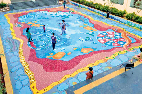 Artist Paints Pond on a School’s Floor